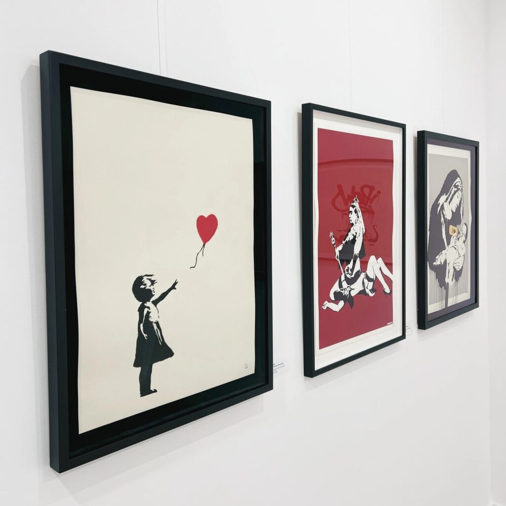 Calder Contemporary - Off the Wall exhibition with Banksy works - girl with balloon, toxic mary