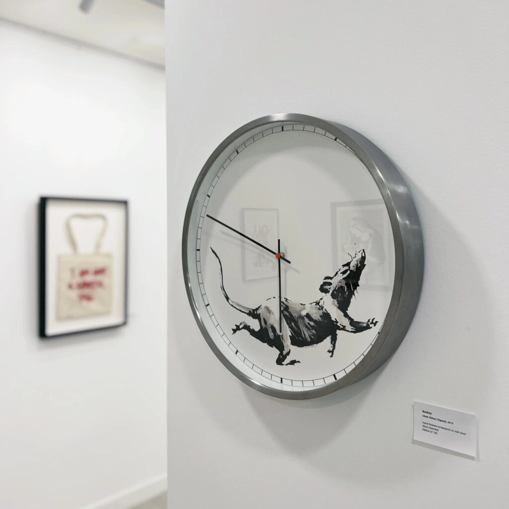 Calder Contemporary - Off the Wall exhibition with Banksy works - clock