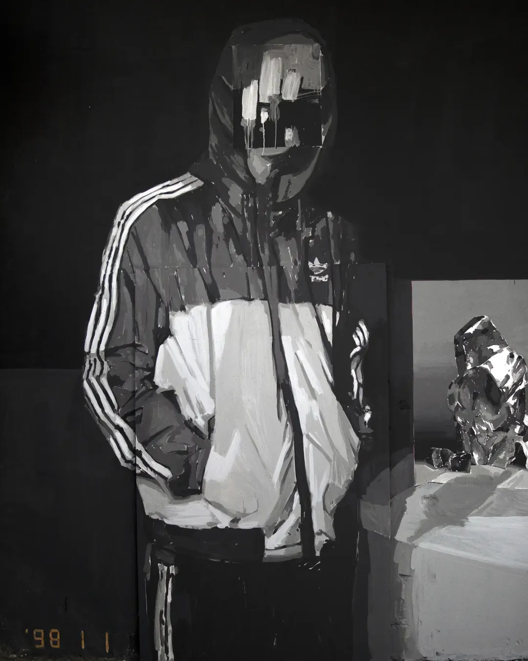Photo by Monos Sotos on September 01, 2026. May be a black-and-white image of raincoat, face mask, sweatshirt, sweatsuit, parka, gas mask and text.