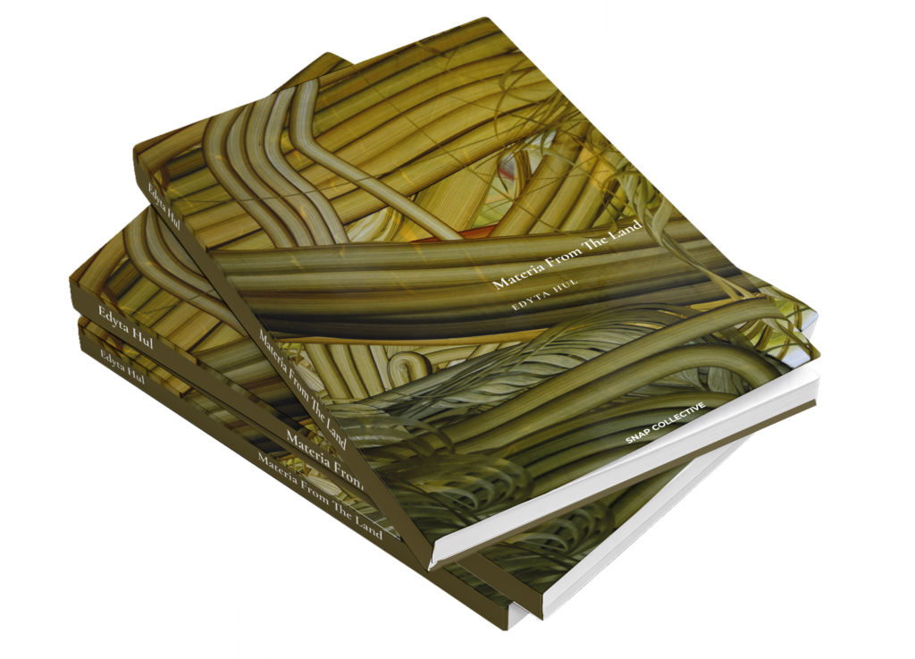 Two copies of Edyta Hul’s Materia From The Land art book with an olive and ochre abstract cover.